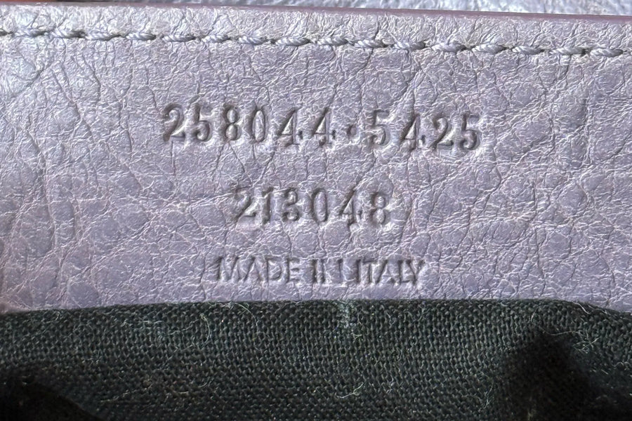Balenciaga serial number tag being verified