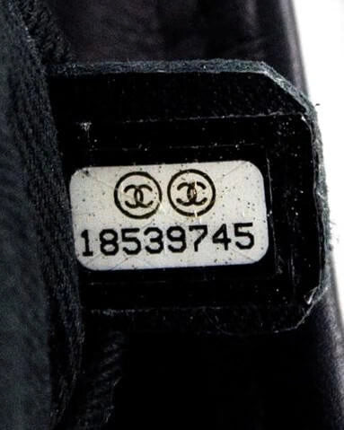 Chanel serial number hologram sticker being verified