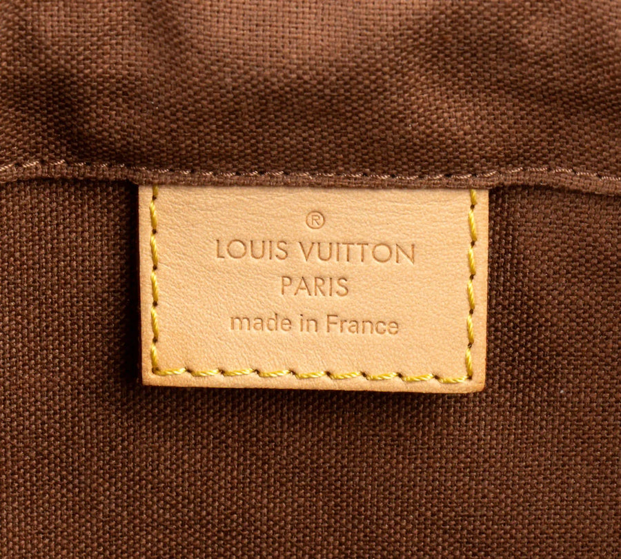 Louis Vuitton interior heat stamp close-up during authentication